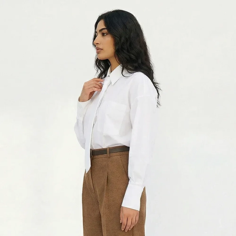 بلوزة نسائية بأكمام طويلة بتصميم بسيط وتفاصيل أكمام دائرية مخيطة - بلوزة مريحة بقصة فضفاضة - قطعة ملابس يومية أنيقة لا تفنى موضتها